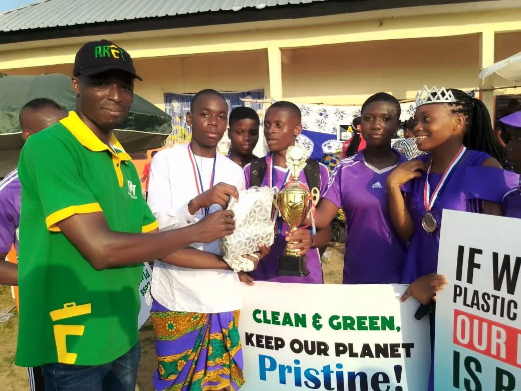 ARET representative engaging award recipients at a community event