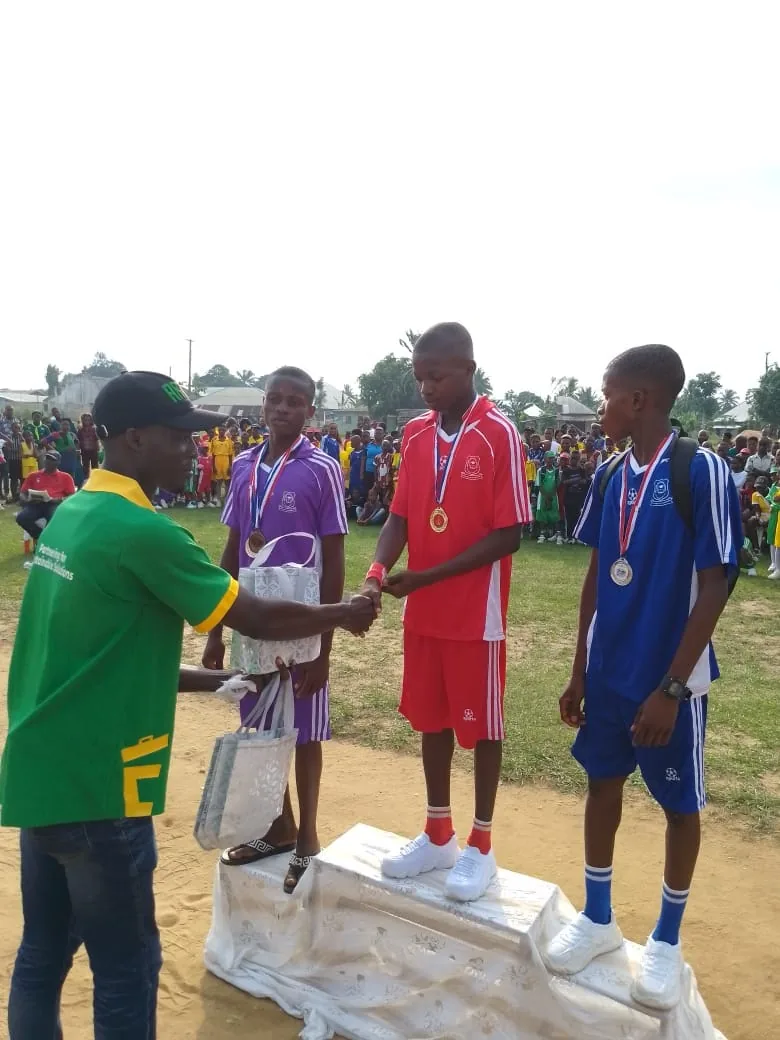 ARET representative presenting awards at a community event