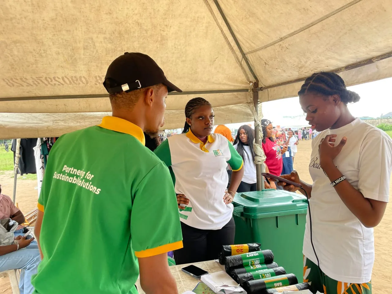 ARET community booth with waste products